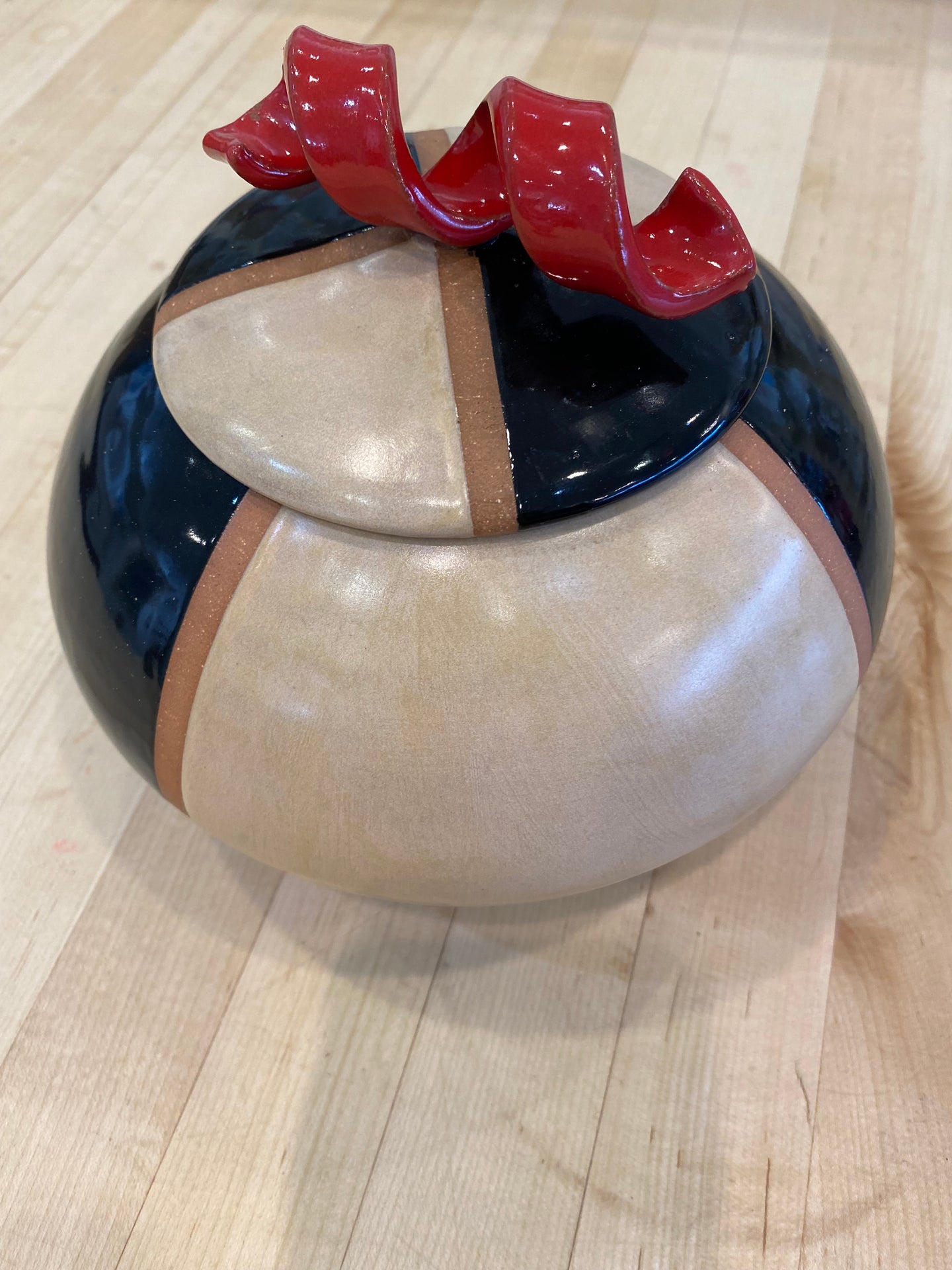 Black and White Jar with Red Handle on the Top